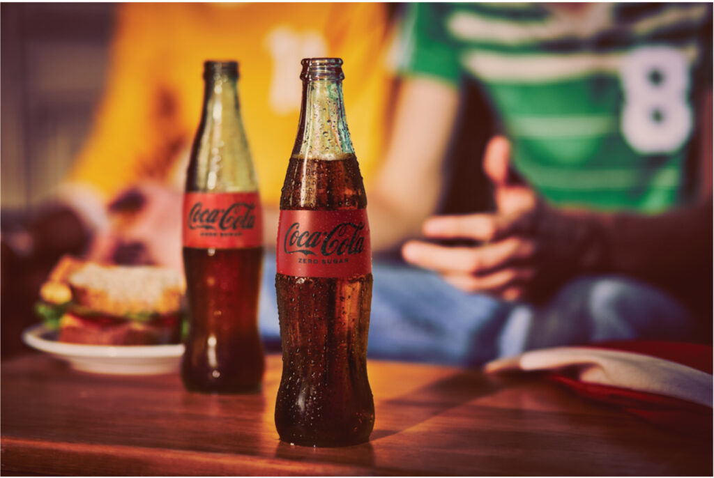 coca cola zero ice cold on table
